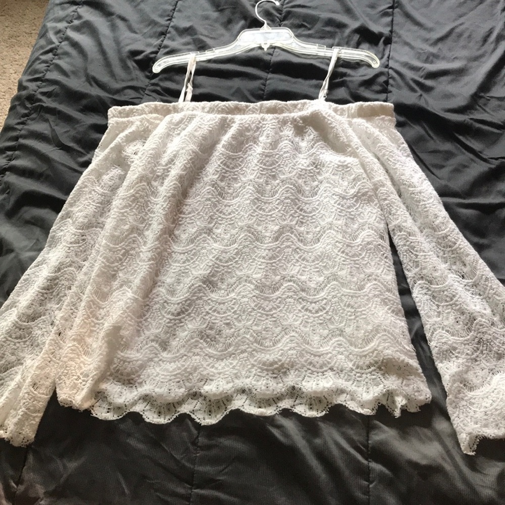 A white lace off the shoulder shirt
